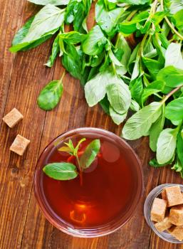 mint tea on the wooden table, fresh tea