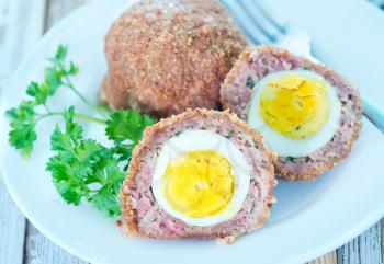 cutlets with boiled egg and on a table