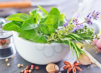 herb and aroma spice in bowl and on a table