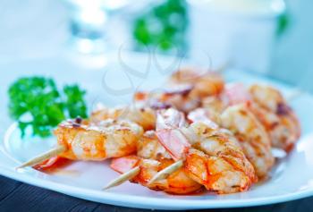 shrimps on plate and on a table