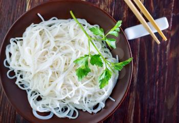 rice noodles on plate and on a table