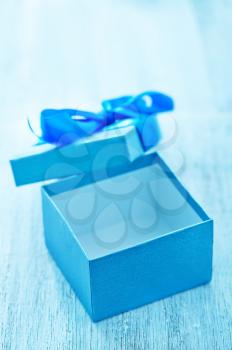 blue box for present on the wooden table