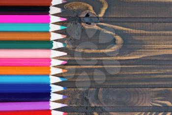  pencils on the wooden table, color pencils 