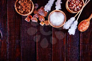 reed and white sugar on the wooden table