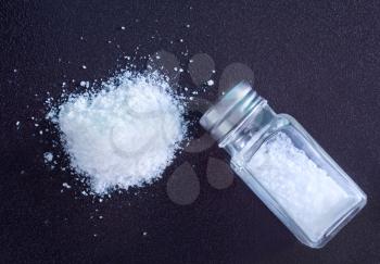 white sea salt in thr glass bottle