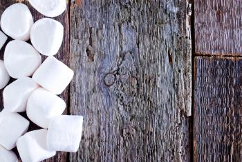 white marshmallows  on the wooden table, fresh and sweet marshmallows