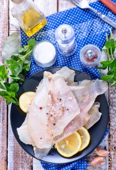 raw fish with aroma spice and fresh lemon