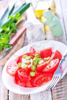 tomato salad on plate and on a table