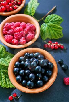 berries in bowl and on a table