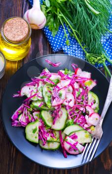 salad with cabbage on plate and on a table