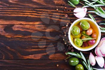 green olives and olive oil with aroma spice