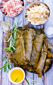 fresh ingredients for dolma: grape leaves and meat