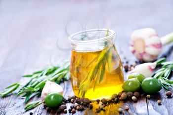 green olives and olive oil in bottle