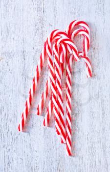 candy canes on the white table, christmas background