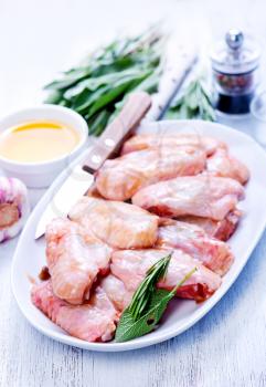raw chicken wings with salt and spice