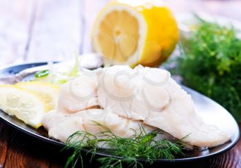 fish fillet with lemon  on the plate