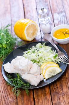 fish fillet with lemon  on the plate