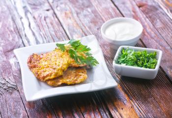 vegetable pancakes on plate and on a table