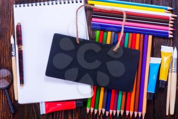 notebook and school supplies on a table