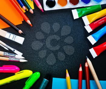 school supplies on the table, color paint and pencils