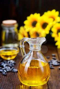 sunflower oil and sunflower seeds on a table
