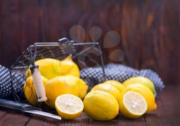 fresh lemons in basket and on a table