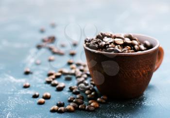 coffee beans in cup and on a table