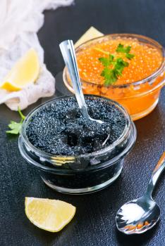 caviar in glass bowls and on a table