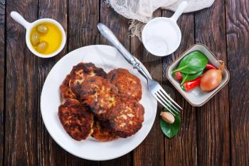 cutlets on white plate and on a table