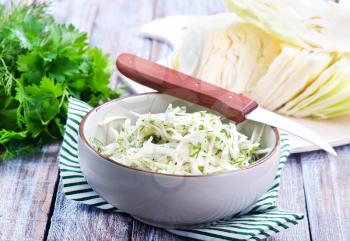 cabbage salad in bowl and on a table