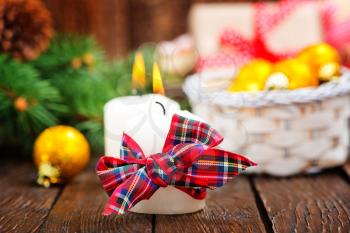 candles with ribbon on a table, christmas decoration