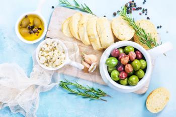 olives and fresh bread on a table