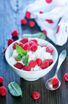 cottage with fresh raspberry in the bowl