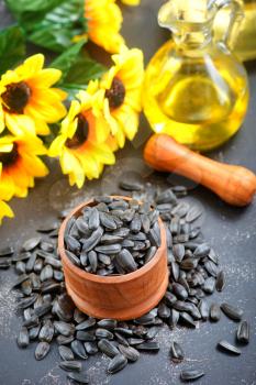 sunflower seed in bowl and on a table