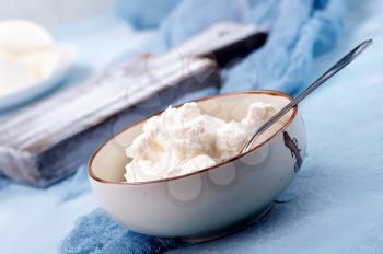 ricotta in bowl and on a table