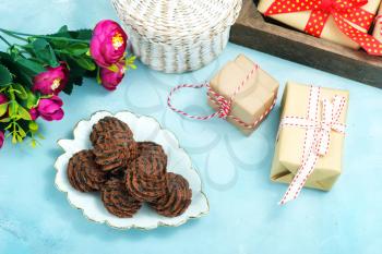 chocolate candy on plate and on a table