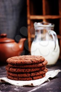 sweet chocolate cookies on the wooden table