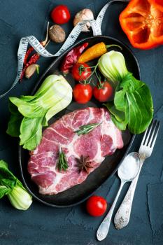 raw meat with spice and fresh vegetables
