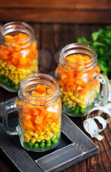 fresh salad with corn and green peas in bank