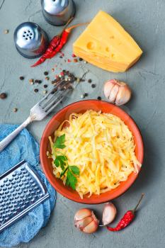 grated cheese and spice on a table