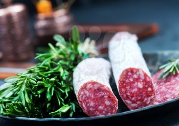 salami with aroma spice on the board