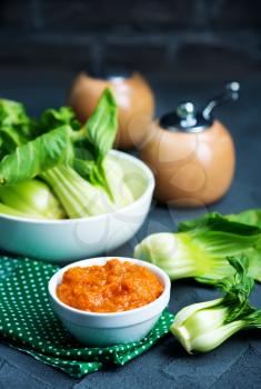 fresh pakchoi with sauce on a table