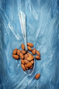 almond on a table, dry almond, nuts on wooden background