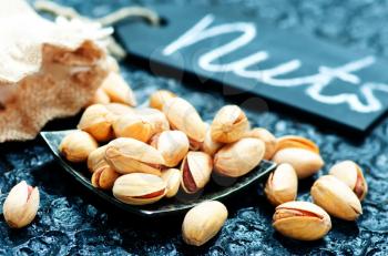 piztachios on a tabble, dry nuts, stock photo