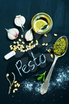 fresh pesto in bowl and on a table