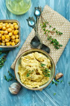humus in bowl and on a table