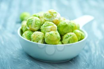 brussel sprouts in bowl and on a table
