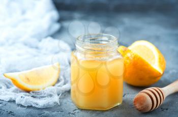 honey with lemon on the gray table