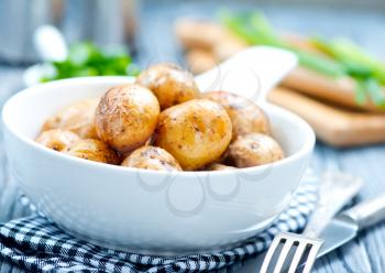 fried potato in bowl and on a table
