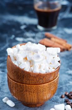 white marshmellow in bowl and on a table